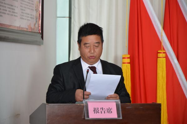 图八：监票人周付华同志报告选举情况